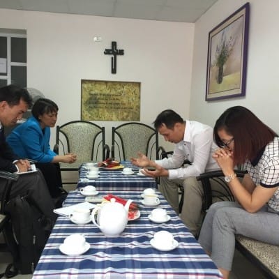 In 2016 IGE CWFL Fellow Chaplain Judy Manala joined the IGE delegation to lecture at our Religion and Rule of Law programing. At a local Evangelical church, she prayed for pastor Bui Quoc Phong.