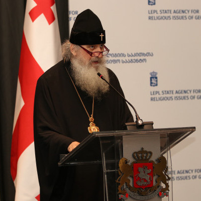 Georgian Orthodox Church priest gives remarks.